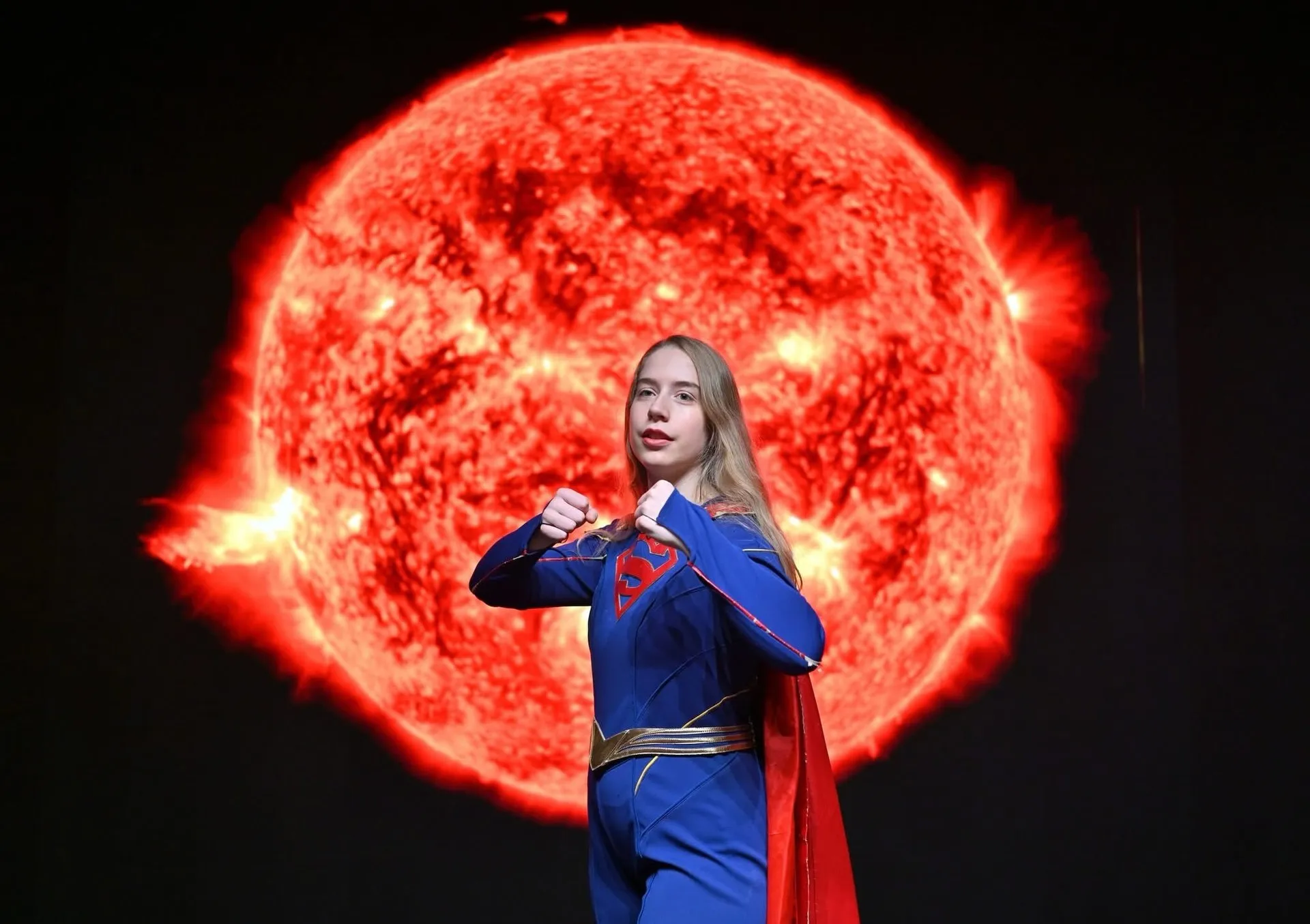 Supergirl cape pose photographed by Greg Johnstone