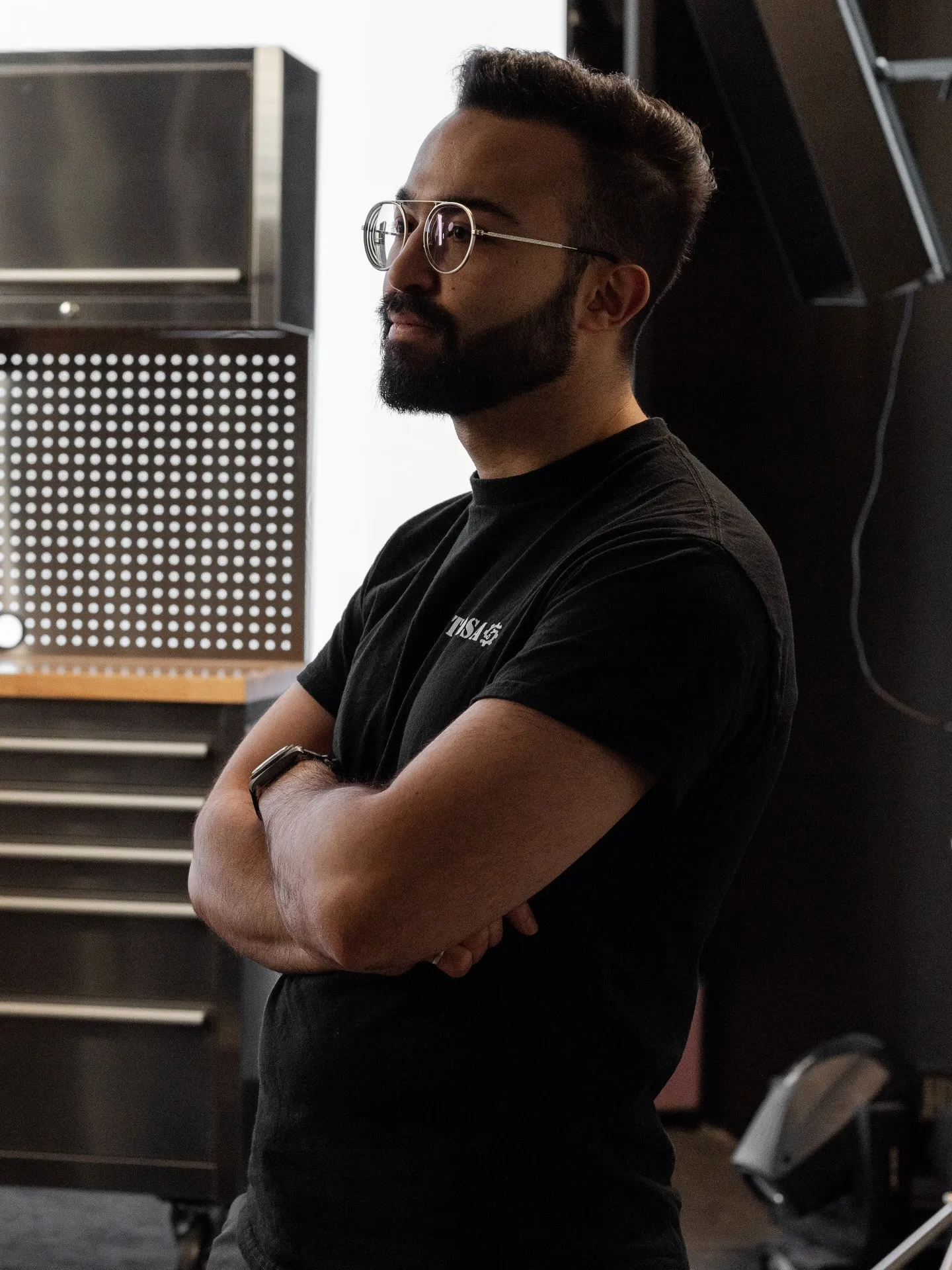 TOOSA presenter beside the product cabinets