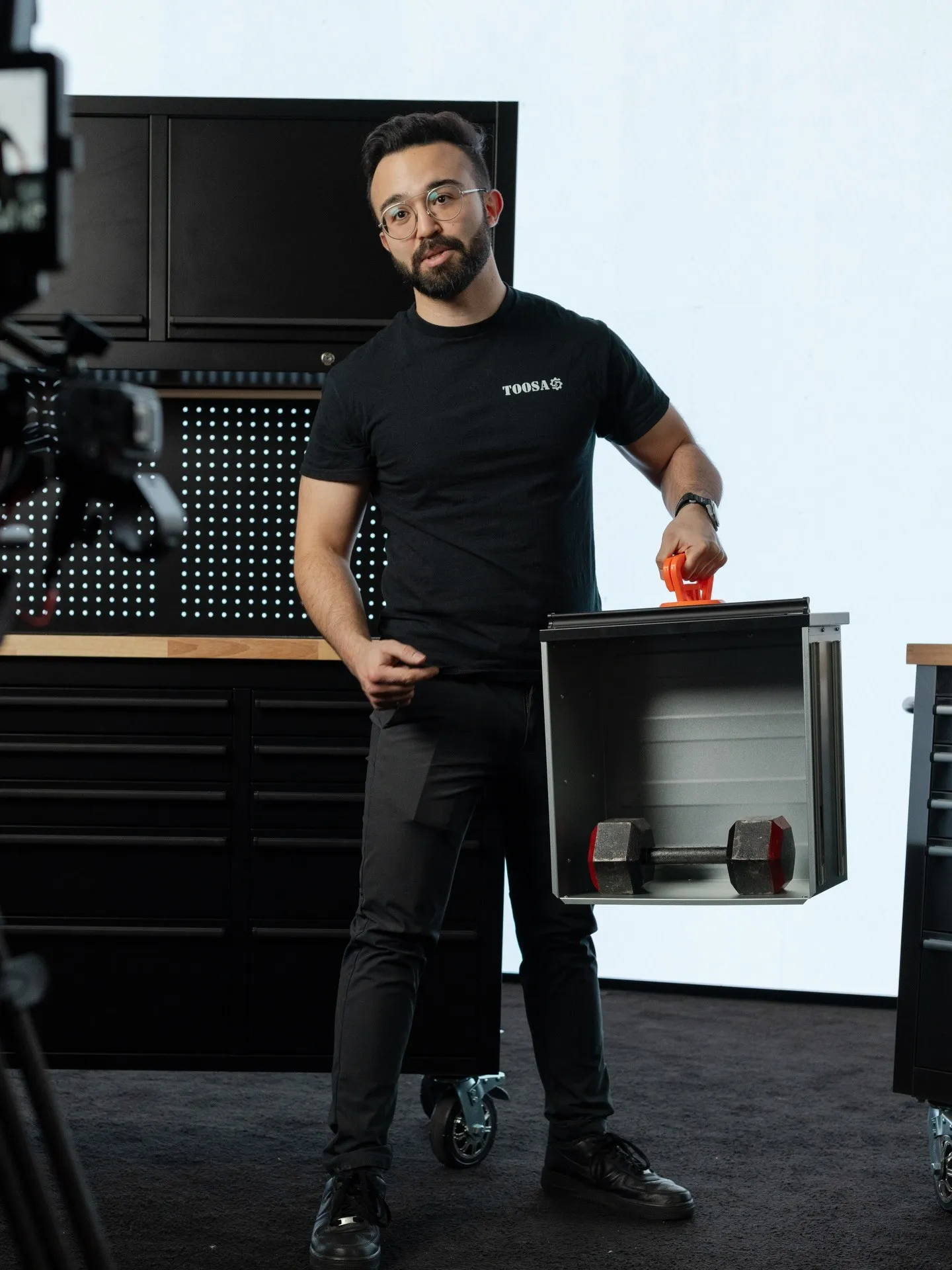 Product demonstration with tool-storage units on set