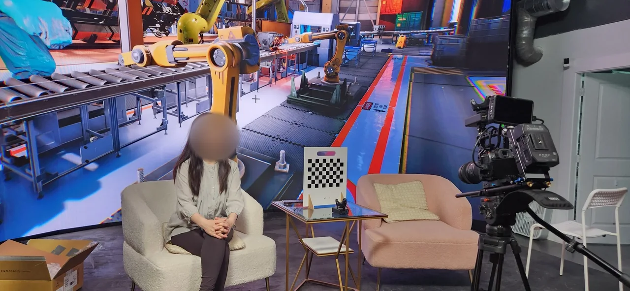Interview chair and calibration chart before a robot factory LED backdrop