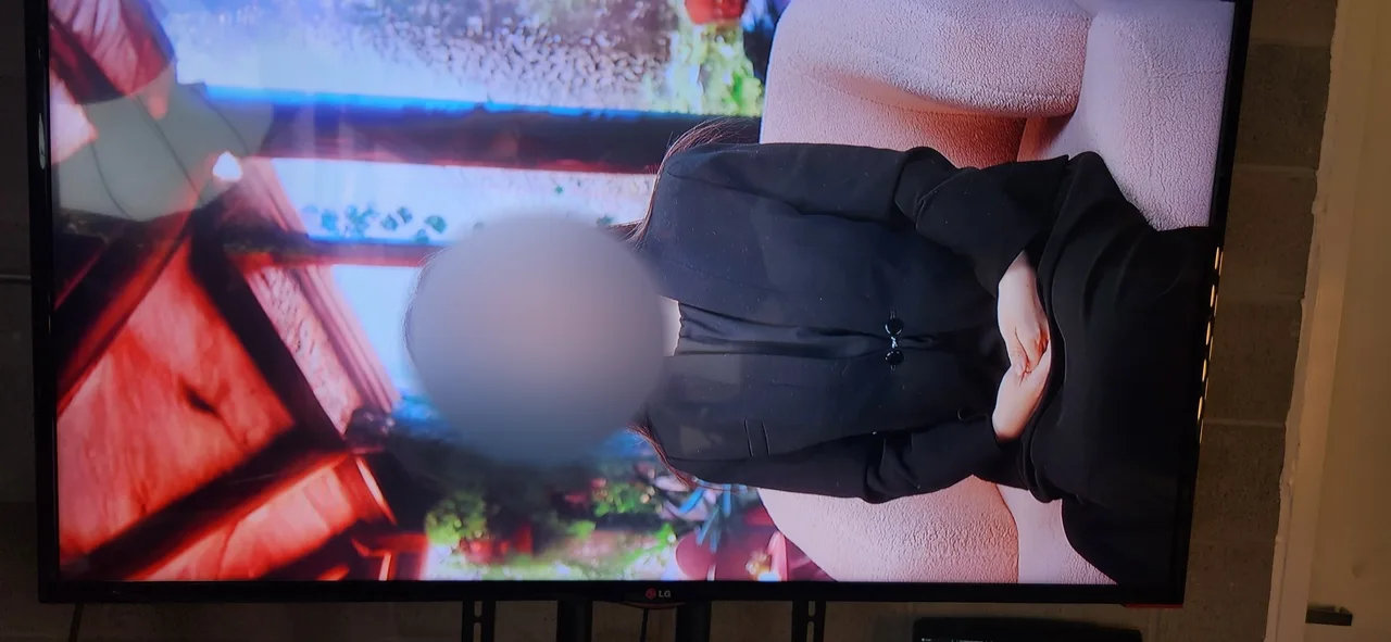 Monitor close-up of the host during an interview recording