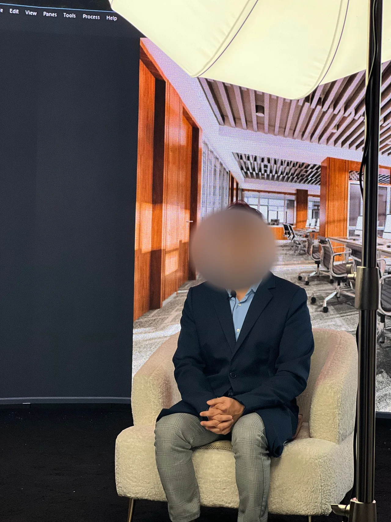 Male guest interviewed in front of an LED wall office backdrop