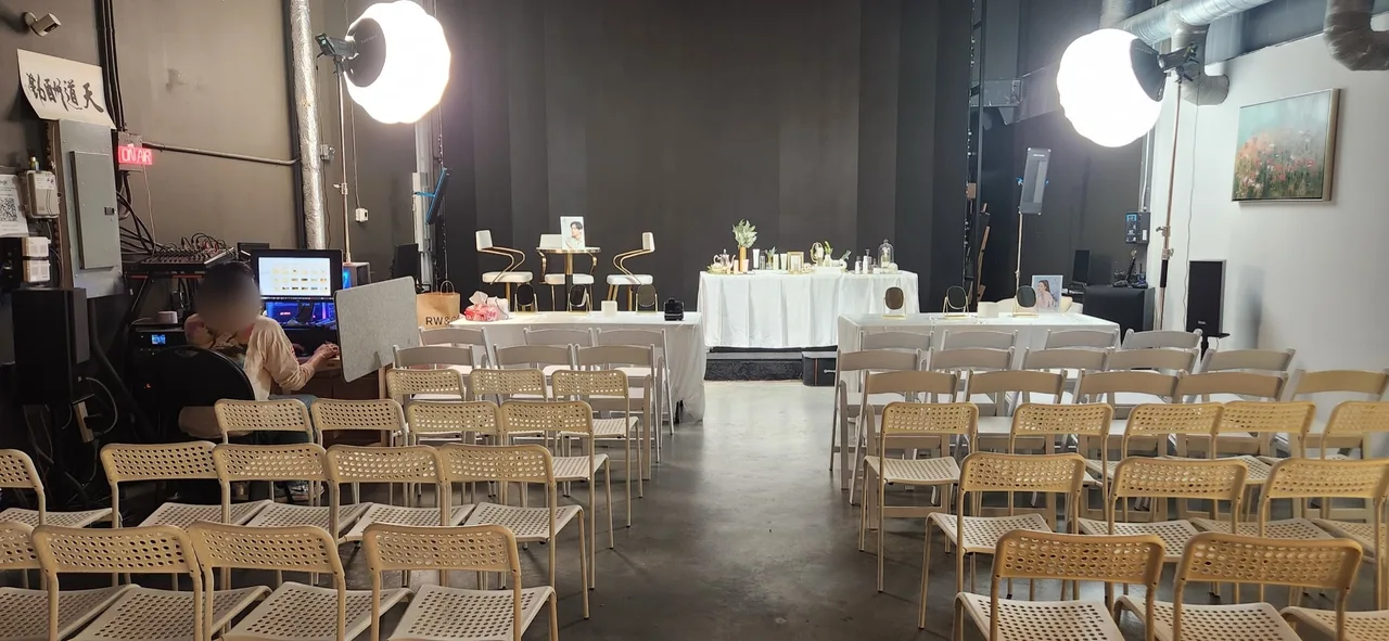 Beauty event room setup with display tables and chairs