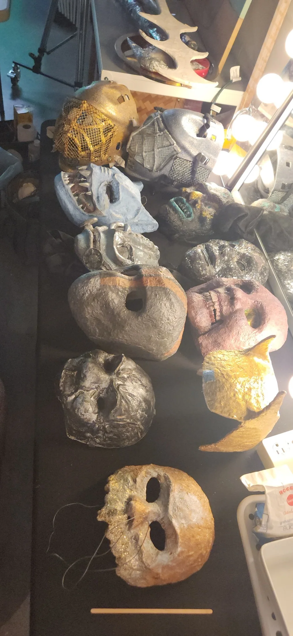 Collection of handmade masks on a makeup table for a film production at Upperland Studio, Richmond BC