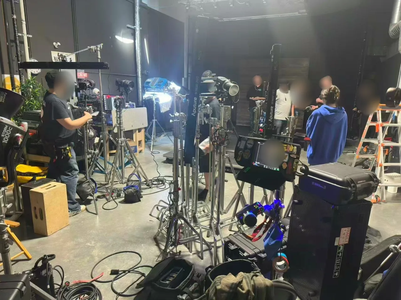 Film crew, camera rigs, lighting and a production monitor during the Flyover Canada studio shoot