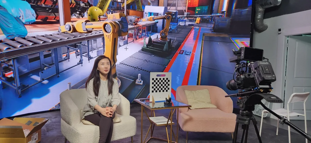 Interview chair and calibration chart before a robot factory LED backdrop