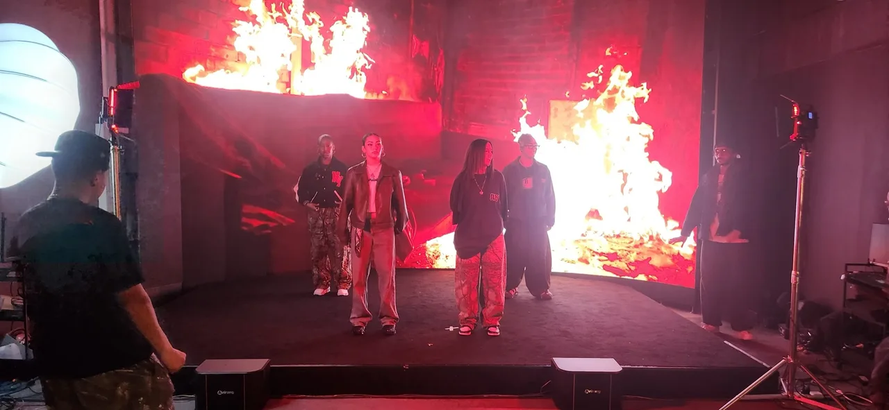Dancers standing before the flame LED wall during the dance shoot