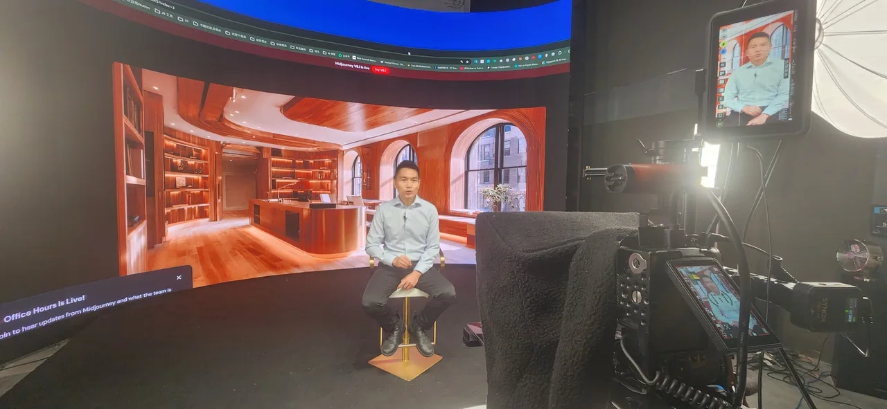 Presenter recording in front of a luxury wooden office backdrop on the LED wall at Upperland Studio, Richmond BC