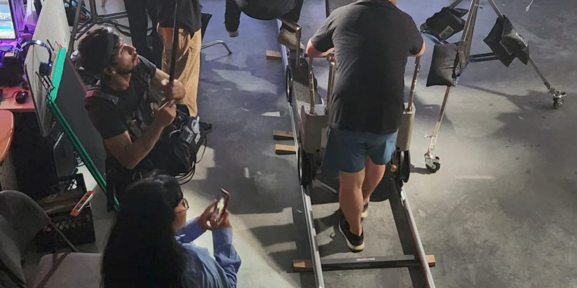 Behind the scenes of Stand In short film - LED wall virtual production at Upperland Studio displaying Tokyo skyline with film crew and dolly track